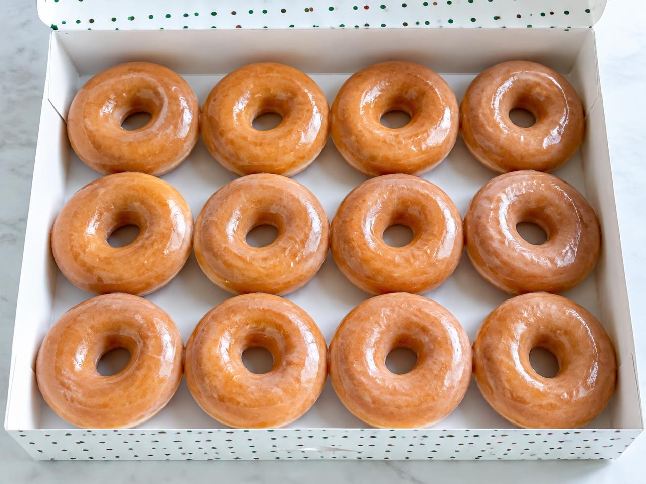 A dozen Krispy Kreme Original Glazed doughnuts
